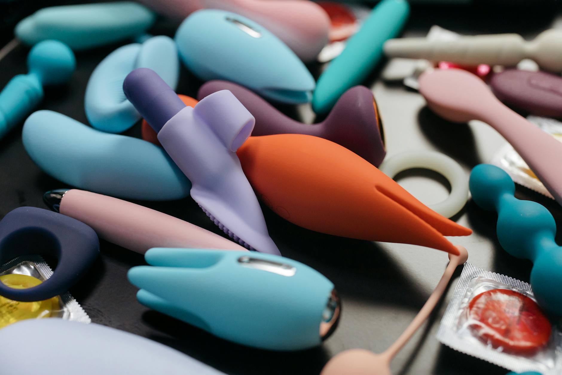 Hands holding a blue personal massager, showing sensitive, intentional touch