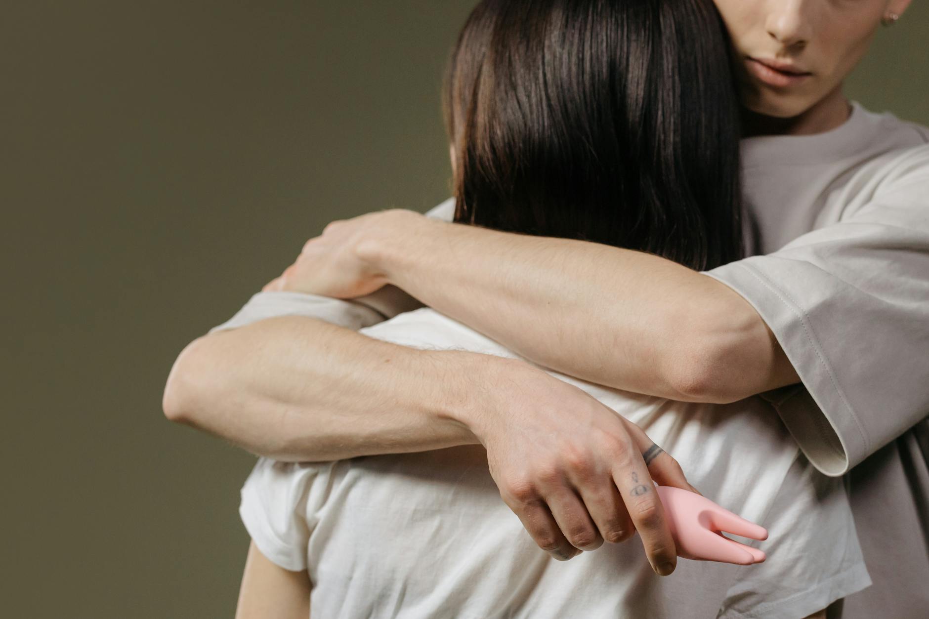 A young couple standing together indoors, showing comfort and openness with modern intimacy